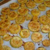 The baked squash rounds on a cookie sheet.
