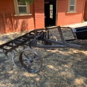 An antique piece of farm equipment.