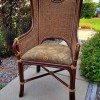 A vintage chair with a woven seat back.