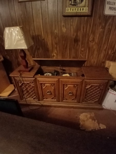 An open record player cabinet.