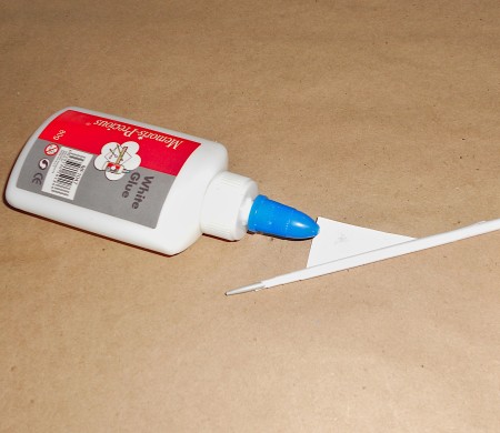 Rolling the strip with glue.