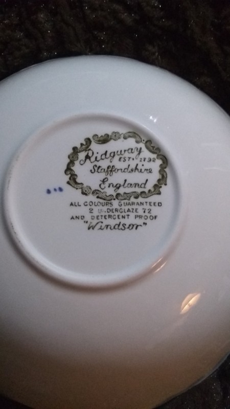 The manufacturer's marking on the bottom of a china plate.