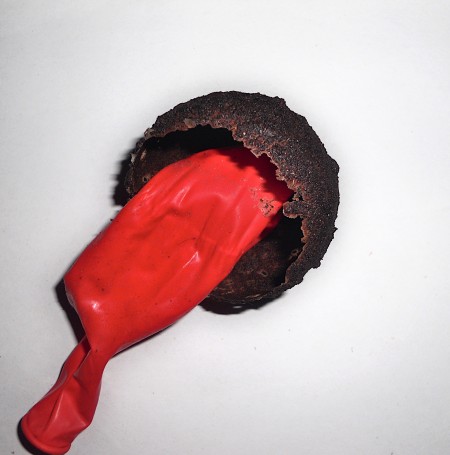 Removing the balloon from the coffee form.