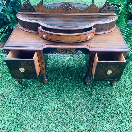 A vintage wooden vanity.
