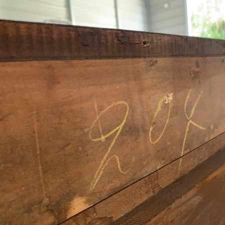 A number written on the back of the vanity.