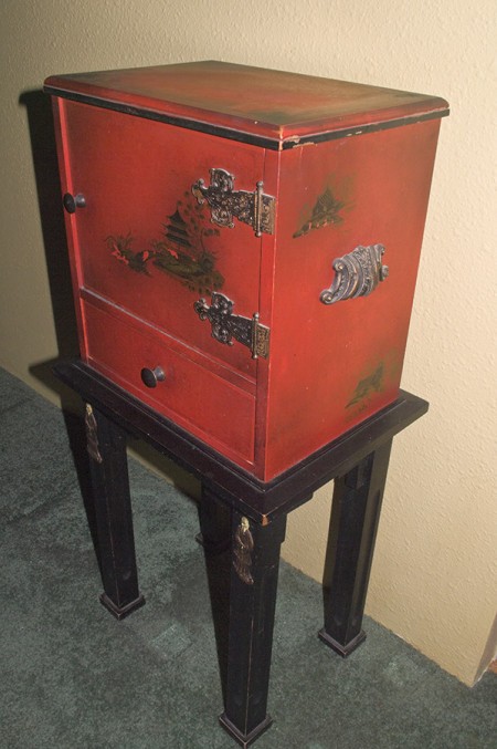 An old red colored humidor.