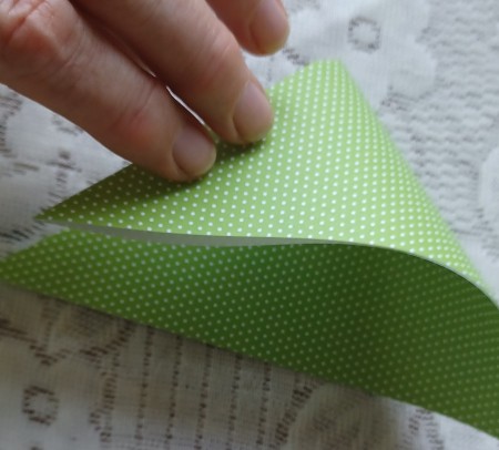 Folding the paper again.