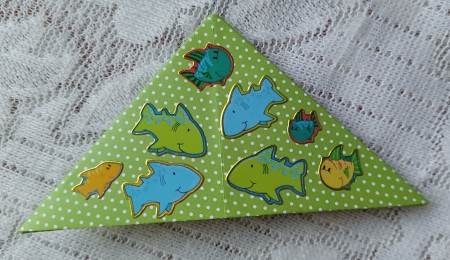 Decorating the bookmark with stickers.