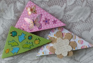 Three differently decorated bookmarks.