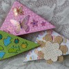 Three differently decorated bookmarks.