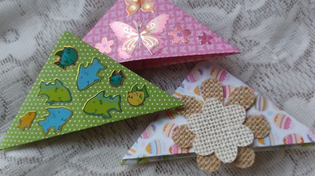 Three differently decorated bookmarks.