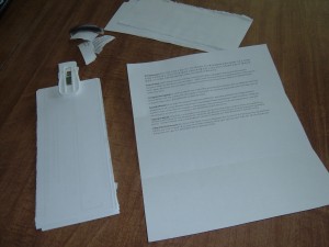 Using the blank back of a piece of junk mail as scratch paper.
