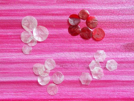 A collection of fish scales in different colors and shapes.