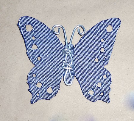 The butterfly shape cut out of fabric.