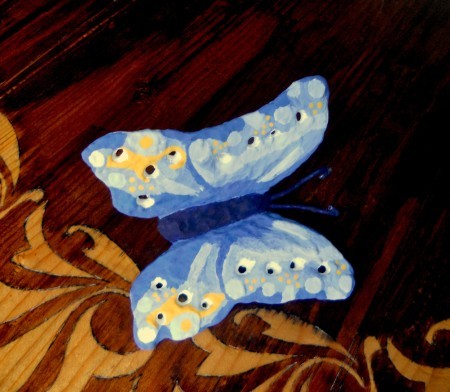 The concrete butterfly after being shaped and painted.