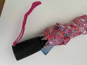 An umbrella with a sticky handle.