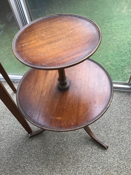 A two-tier round wooden table.
