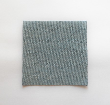 A square piece of recycled denim.