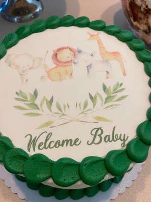 A baby shower cake with an animal theme.