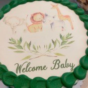 A baby shower cake with an animal theme.