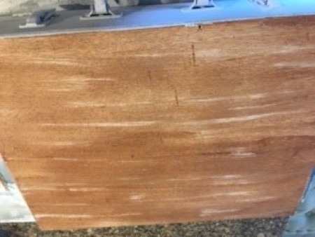 Painting the suitcase brown.