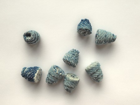 A collection of triangular denim beads.