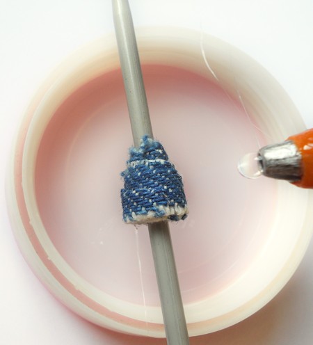 Creating the bead with fabric and glue.