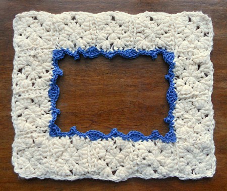 The frame with blue edging.