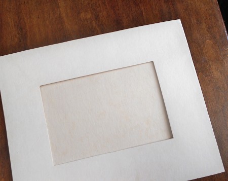 A white cardboard frame.