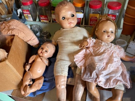 A collection of old baby dolls.