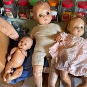 A collection of old baby dolls.