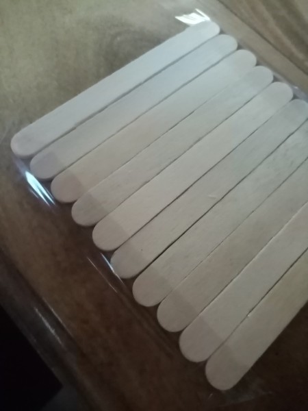 Taping the sticks together.