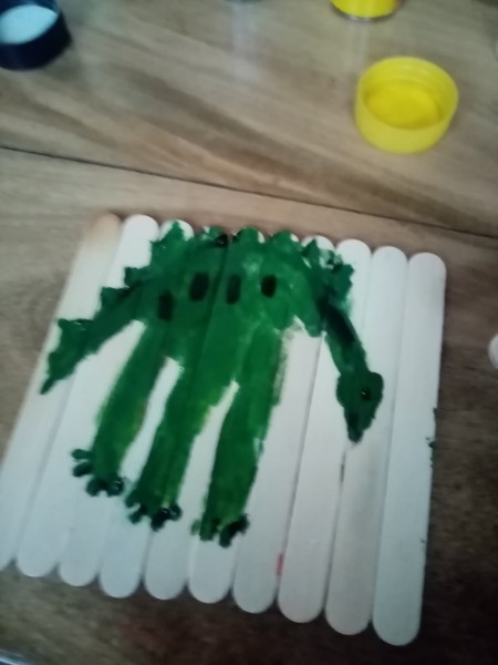 Adding details to make it look like a dinosaur.