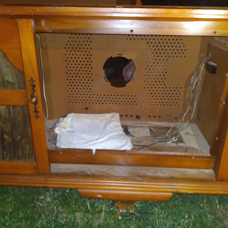 The cabinet of an old console stereo.