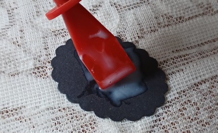 Gluing the back of the pendants.