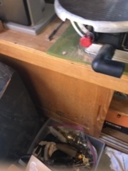 Cutting a hole in the top of a box.