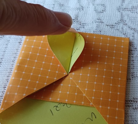 Folding the corners of the letter.