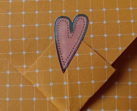 Closing the letter with a decorative sticker.