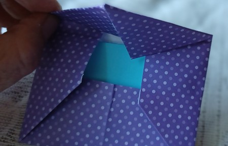 Closing the envelope.