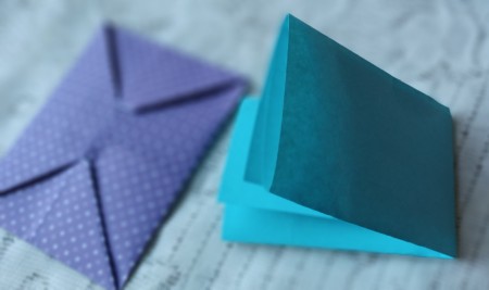 Folding the letter to fit inside.