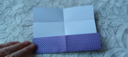 Folding the paper again.