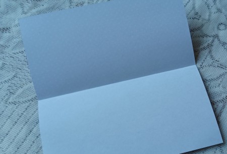 A folded piece of square paper.