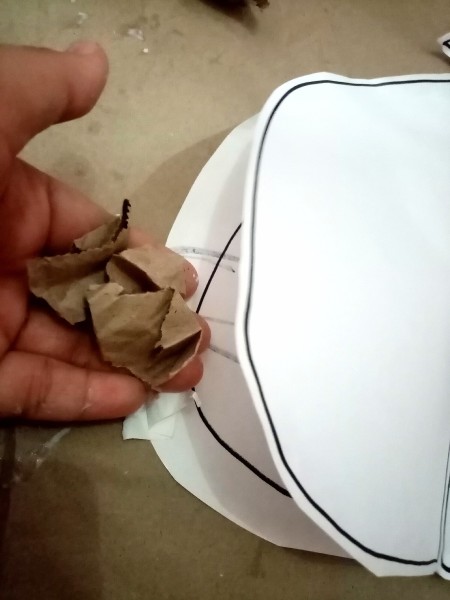 Adding crumpled paper to the inside.