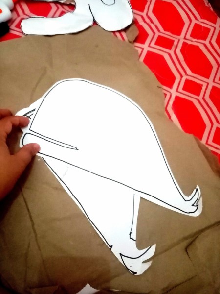 Tracing and cutting out two sides of the whale.