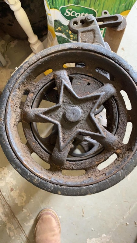 The wheel of a reel mower.