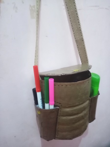 The travel bag with supplies in the outer pockets.