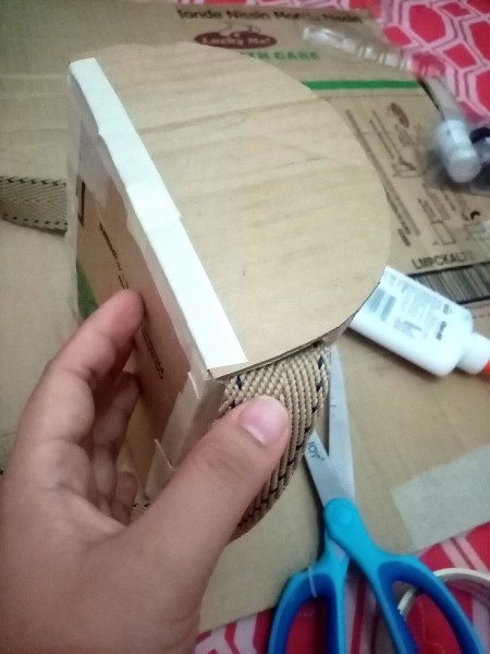 Adding a strap to the bag.