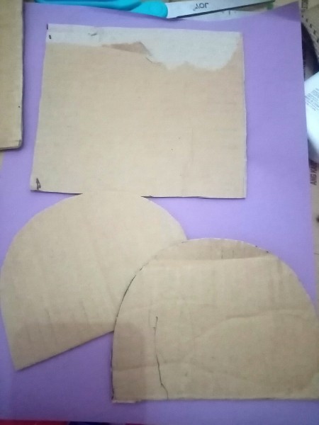 Pieces of cardboard cut into shapes.