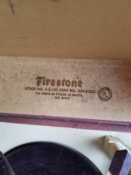The Firestone label on an old record player.