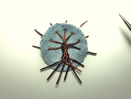 Weaving the wire into the denim.